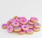 Donuts decorated icing and sprinkles on white background