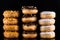 Donuts or Doughnuts Tower on Dark Background. Donut Stack Pile Food Background