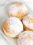 Donuts with frosting and powdered sugar