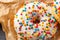 Donuts glazed with various sprinkles