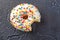 Donuts glazed with various sprinkles