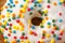 Donuts glazed with various sprinkles