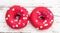 Donuts with heart sprinkles on white wooden background. Donut for bakery menu