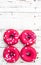 Donuts with heart sprinkles on white wooden background. Donut for bakery menu. Valentine Day food idea. Funny donut.