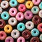 Donuts pattern. Top view of a variety of glazed donuts. Colorful glazed donuts with sprinkles