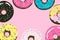 Donuts pink background for cover, postcard, banner etc