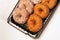 Donuts in a plastic container