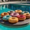 Donuts served by the pool. Tasty breakfast on wooden board.