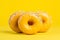 Donuts tasty fast food street food for take away on yellow background