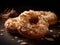 Donuts topped with coconut and almonds on a wooden table