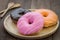 Donuts on wooden plate