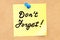 Donâ€™t Forget text on a sticky note pinned to a corkboard. 3D r