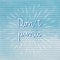 Donâ€™t panic hand lettering with sunburst lines on blue corrugated paper