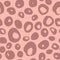 Doodle animal spot seamless pattern. Hand drawn jungle leather silhouettes in pale pink tones