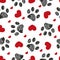 Doodle black paw print with red shining hearts seamless for fabric pattern