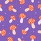 Doodle calm orange-red mushrooms and white dots on purple background. Seamless autumn food pattern.