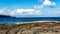 Doolin bay with stones and calm water with the cliff de Moher in the background