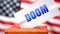 Doom and American elections, symbolized as ballot box with American flag in the background and a phrase Doom on a ballot to show