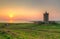 Doonagore castle at sunset