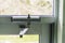 Door Closer on Glass door on building entrace