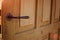 Door handle in the interior. Knob close-up elements. Open and closed light wooden doors in in modern style in the