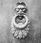 Door Knockers close up on a door, Siena, Tuscany, Italy (black and White)