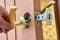 Door latch is placed in groove of interior door to align with door handle.