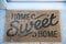 Door Mat with the words: Home Sweet Home.