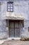 Door and metallic facade of an old house, in Milia village, near Metsovo, Greece