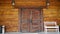 door. Old wooden entrance doors with a brass handle in the city. Arched door. A beautiful street door with an arch