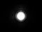 Door peephole lens blur spotlight graphic in black background