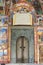 Door and Religious frescoes on the treatises from the Bible, painted on the church wall in Rila Monastery, Bulgaria