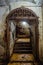 Door with a rusty carved lattice in an old basement