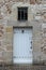 The door of a stone house in SachÃ©, France, was painted in white