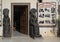 Door to the Taharqa 1 Bookshop flanked by statues of the Egyptian God of War, Maahes.