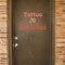 Door to tattoo parlor.