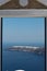 Through a door towards the oceanfront on Santorini island