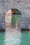 Door in the water in Scaliger Castle in Sirmione. Garda Lake - Travel destination in Italy.