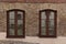 Door and window on the wall of a wooden and stone house