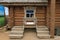 Door and window on the wall of a wooden and stone house