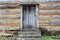 Door in wood and brick log cabin