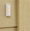Doorbell button on house home exterior front door details.