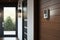 doorbell, with view of front door, in sleek and modern house