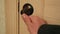 Doorknob turns and the door opens