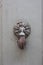 Doorknocker on the front door of the Italian building