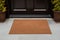 Doormat at entrance Blank brown mat with inviting welcome appeal