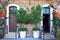 Doors, plants and flowers in a traditional stone mediterranean h