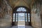 Doorway to balcony with distant view of Como Villa Carlotta Tremezzo, Como Lake, Italy