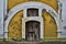 Doorway with White Arch and Bright Yellow Wall