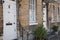 Doorways to residential properties on The High Street in Woodstock, Oxfordshire, UK 06 22 2020